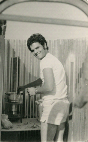 Benny Maymon cooking on a kerosene burner at Rina and Benny’s home in Shmuel HaNavi neighborhood.